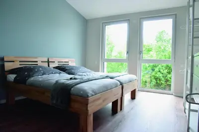 Ein Bett oder Betten in einem Zimmer der Unterkunft Sonnenscheinhaus Wohnung 2