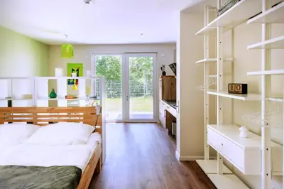 Ein Bett oder Betten in einem Zimmer der Unterkunft Sonnenscheinhaus Wohnung 3