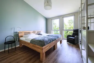 Ein Bett oder Betten in einem Zimmer der Unterkunft Sonnenscheinhaus Wohnung 4