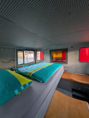 Ein Bett oder Betten in einem Zimmer der Unterkunft Oldtimer Camp Main Spessart
