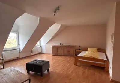 Ein Bett oder Betten in einem Zimmer der Unterkunft Gästehaus Im Unnerdorf