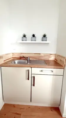 Küche/Küchenzeile in der Unterkunft Benmey Apartment Küche,TV,Waschmaschine