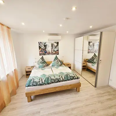 Ein Bett oder Betten in einem Zimmer der Unterkunft Ferienwohnung Popp Langen
