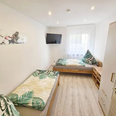 Ein Bett oder Betten in einem Zimmer der Unterkunft Ferienwohnung Popp Langen
