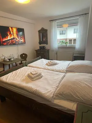 Ein Bett oder Betten in einem Zimmer der Unterkunft Apartmenthaus Wilder Mann