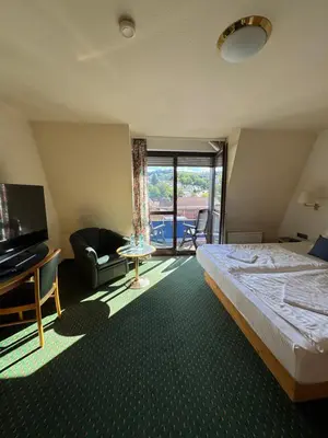 Ein Bett oder Betten in einem Zimmer der Unterkunft Apartmenthaus Wilder Mann