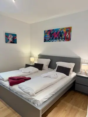 Ein Bett oder Betten in einem Zimmer der Unterkunft Apartmenthaus Wilder Mann