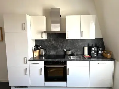 Küche/Küchenzeile in der Unterkunft Charmante Altbauwohnung im Herzen von Rastatt kostenloser Parkplatz