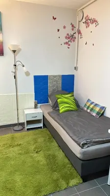 Ein Bett oder Betten in einem Zimmer der Unterkunft Guest House BiBi-Lux