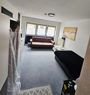 Ein Bett oder Betten in einem Zimmer der Unterkunft City Apartment
