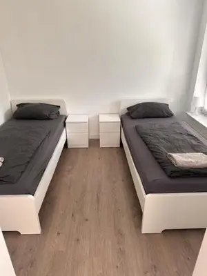 Ein Bett oder Betten in einem Zimmer der Unterkunft 3 Schlafzimmer Wohnung für 6 Personen in Wörrstadt inkl Terrasse & Garten