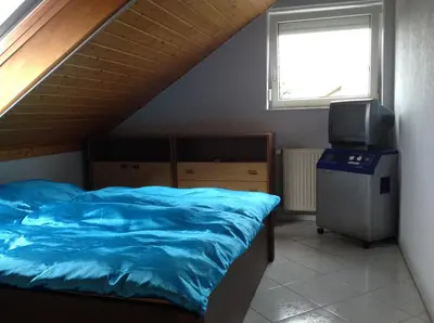 Ein Bett oder Betten in einem Zimmer der Unterkunft HomeStay Sandra