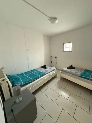 Ein Bett oder Betten in einem Zimmer der Unterkunft Spacious Apartment in Mörfelden-Walldorf
