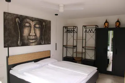 Ein Bett oder Betten in einem Zimmer der Unterkunft URBAN SUITE - Gleis6