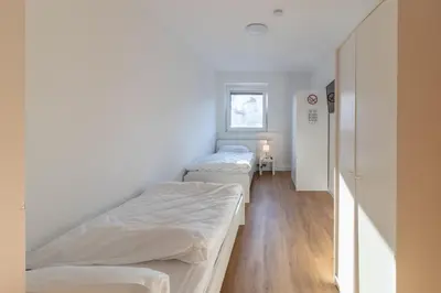 Ein Bett oder Betten in einem Zimmer der Unterkunft Haus Zehnfreunde