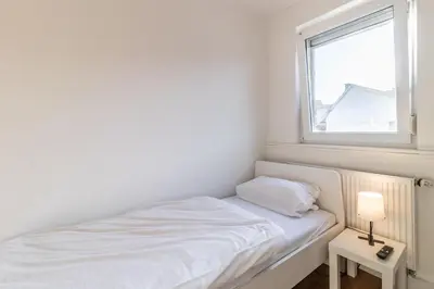 Ein Bett oder Betten in einem Zimmer der Unterkunft Haus Zehnfreunde