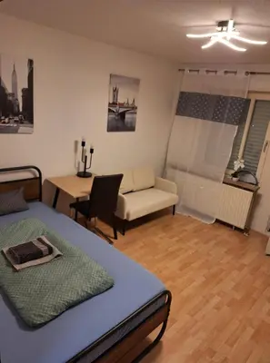 Ein Bett oder Betten in einem Zimmer der Unterkunft Kleines Appartement mit Terasse