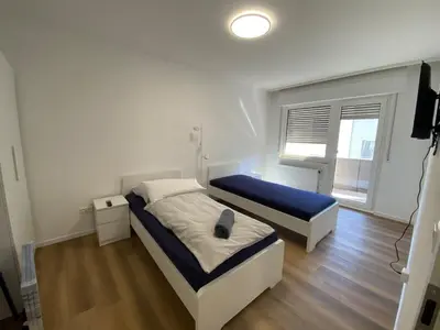 Ein Bett oder Betten in einem Zimmer der Unterkunft 3-Zimmer Apartment mit Balkon
