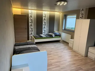 Ein Bett oder Betten in einem Zimmer der Unterkunft Apartment am Mainparksee