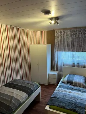 Ein Bett oder Betten in einem Zimmer der Unterkunft Apartment am Mainparksee
