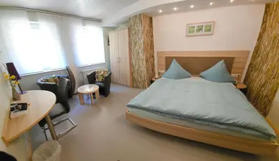 Ein Bett oder Betten in einem Zimmer der Unterkunft Kleines Landhaus Wendel