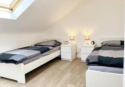 Ein Bett oder Betten in einem Zimmer der Unterkunft City Rooms Heppenheim