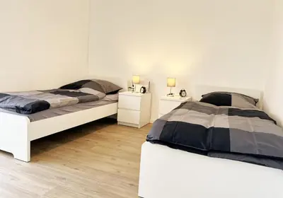 Ein Bett oder Betten in einem Zimmer der Unterkunft City Rooms Heppenheim