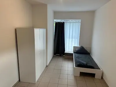 Ein Bett oder Betten in einem Zimmer der Unterkunft 3 Schlafzimmer, Wohnzimmer, Küche, Bad, Terrasse, Parkplatz