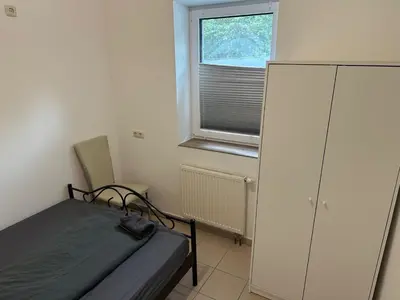 Ein Bett oder Betten in einem Zimmer der Unterkunft 3 Schlafzimmer, Wohnzimmer, Küche, Bad, Terrasse, Parkplatz
