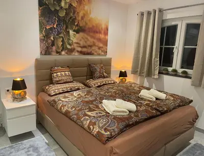 Ein Bett oder Betten in einem Zimmer der Unterkunft Saras Weinchalet