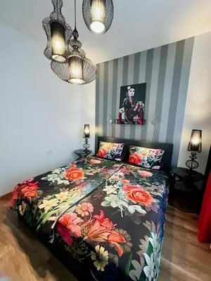 Ein Bett oder Betten in einem Zimmer der Unterkunft High Level Apartment