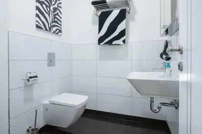 Ein Badezimmer in der Unterkunft High Level Apartment