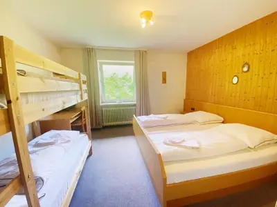 Ein Bett oder Betten in einem Zimmer der Unterkunft Zum Goldenen Löwen