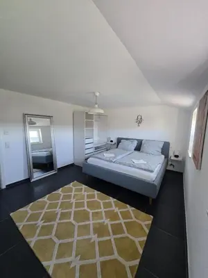 Ein Bett oder Betten in einem Zimmer der Unterkunft Urlaubsoase mit Panoramabalkon & Platz für 6 Personen