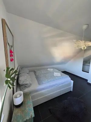 Ein Bett oder Betten in einem Zimmer der Unterkunft Urlaubsoase mit Panoramabalkon & Platz für 6 Personen