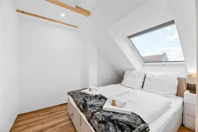 Ein Bett oder Betten in einem Zimmer der Unterkunft TOP Apartments - Modernes Appartement im Stadtzentrum - Klima - Netflix