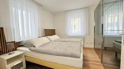 Ein Bett oder Betten in einem Zimmer der Unterkunft 2-Zimmer-Wohnung-Küche-Bad-Terrasse, Bahnhofsnähe