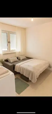 Ein Bett oder Betten in einem Zimmer der Unterkunft Petite Belle