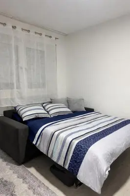 Ein Bett oder Betten in einem Zimmer der Unterkunft Petite Belle
