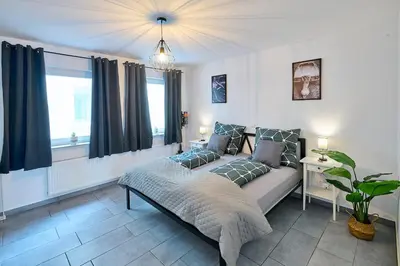 Ein Bett oder Betten in einem Zimmer der Unterkunft Wohlfühlnest St Leon Rot Aufzug Klima Balkon