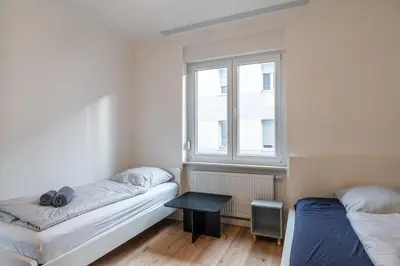 Ein Bett oder Betten in einem Zimmer der Unterkunft Am Pfälzerplatz - 3 Zimmer und 6 Betten