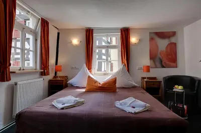 Ein Bett oder Betten in einem Zimmer der Unterkunft Hotel Kleine Radlerherberge