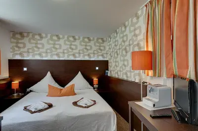 Ein Bett oder Betten in einem Zimmer der Unterkunft Hotel Kleine Radlerherberge