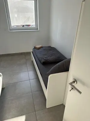 Ein Bett oder Betten in einem Zimmer der Unterkunft 3 Zimmer Wohnung mit Balkon und Parkplatz