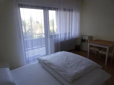 Ein Bett oder Betten in einem Zimmer der Unterkunft Hotel-Pension Schlossgarten
