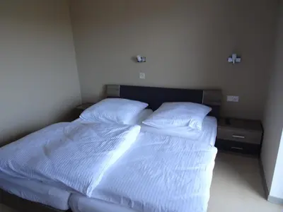 Ein Bett oder Betten in einem Zimmer der Unterkunft Hotel-Pension Schlossgarten
