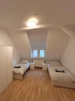 Ein Bett oder Betten in einem Zimmer der Unterkunft Monteurs- und Ferienwohnung Miltenberg