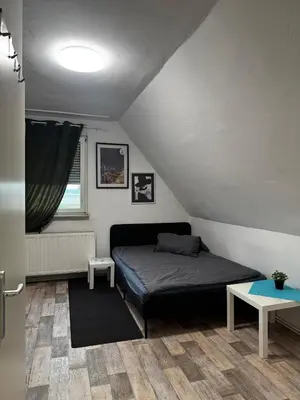 Ein Bett oder Betten in einem Zimmer der Unterkunft Frankenthal