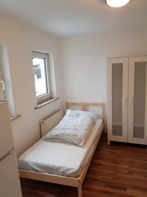 Ein Bett oder Betten in einem Zimmer der Unterkunft Augustenburgstr 34 Karlsruhe Whg 10
