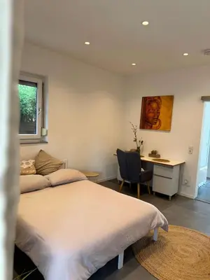 Ein Bett oder Betten in einem Zimmer der Unterkunft Modernes Apartment - Kirchfeld